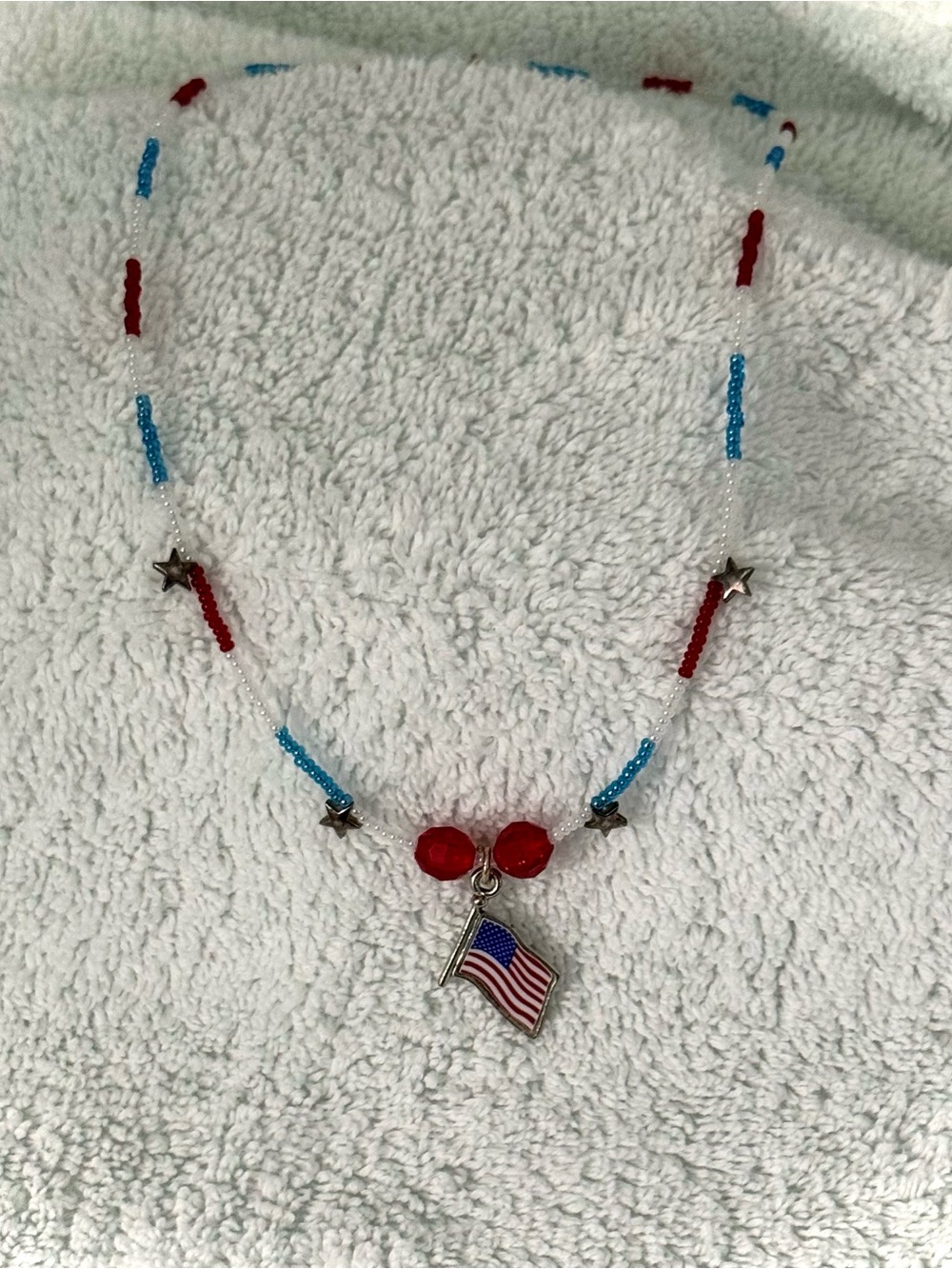 Elegant Beaded Necklace with a USA Flag Charm
